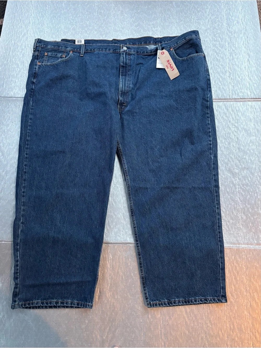 NWT Levi's 550’s with a 63W x 30L relaxed fit.